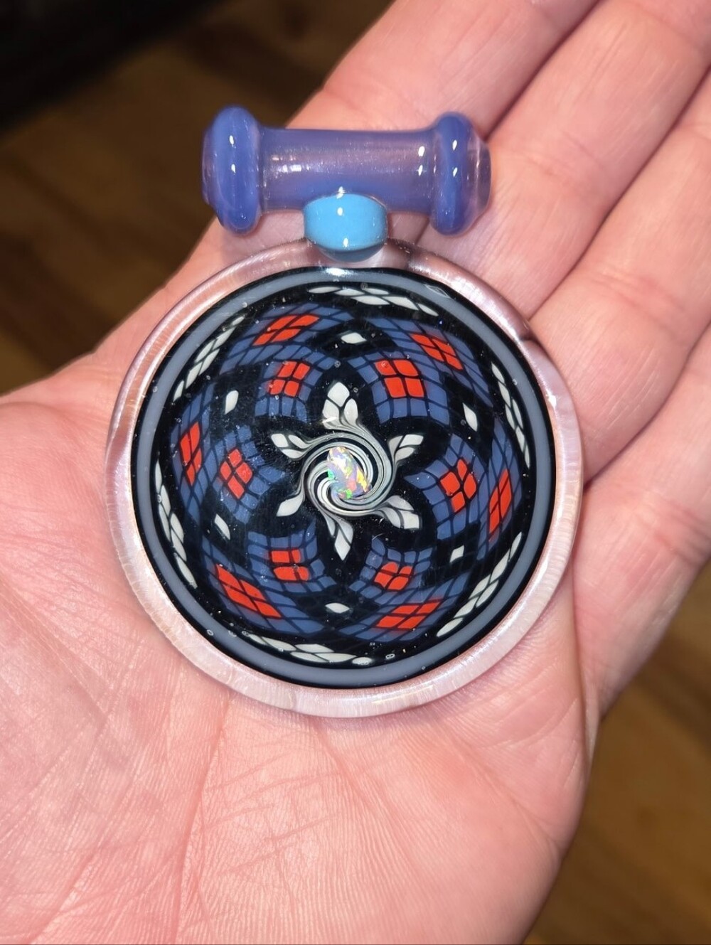 handcrafted glass pendant featuring a detailed multi-color fillacello pattern
